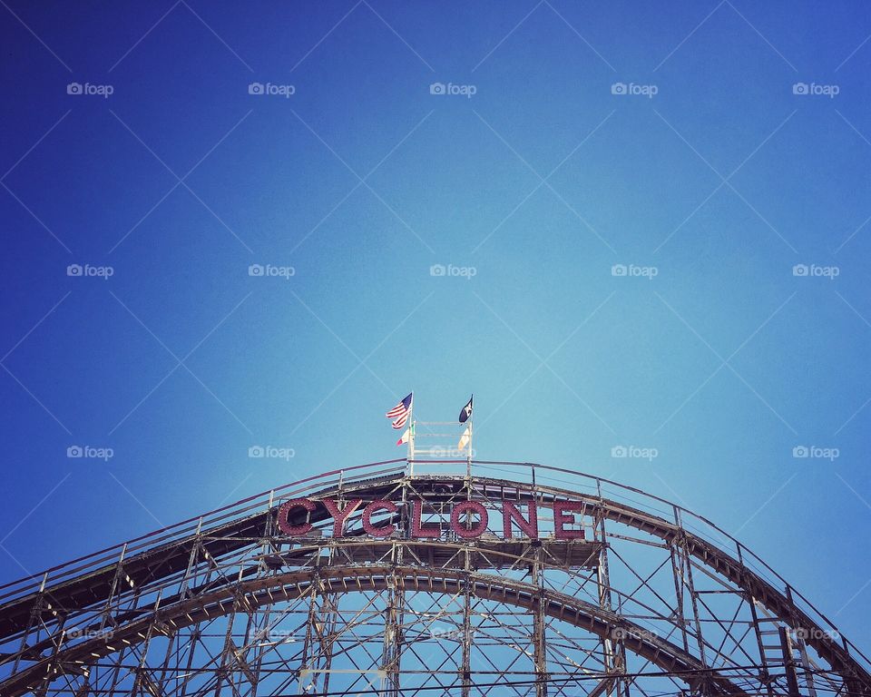 Top of roller coaster in blue sky