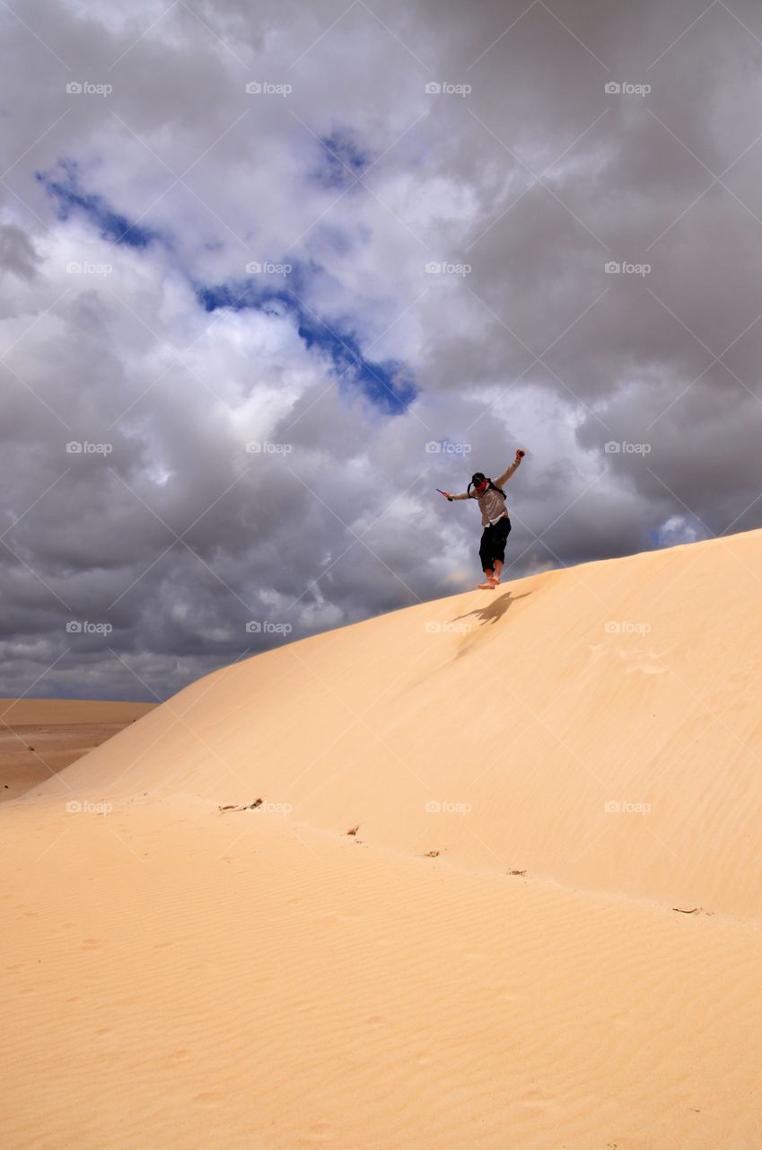 Jumping in corralejo dunes Fuerteventura island 