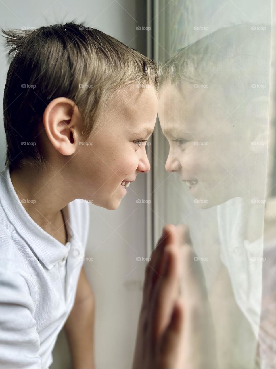 boy looking out the window