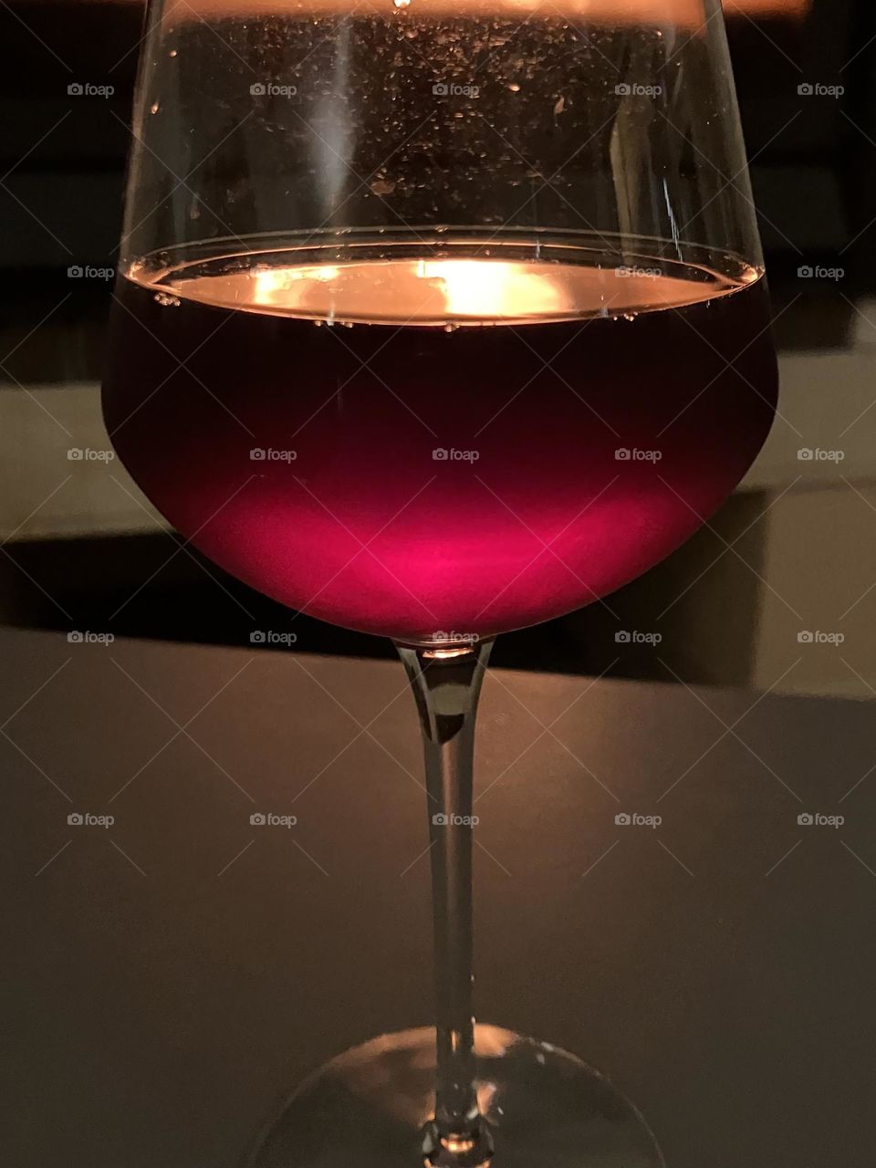 Magenta color at the bottom of a glass 