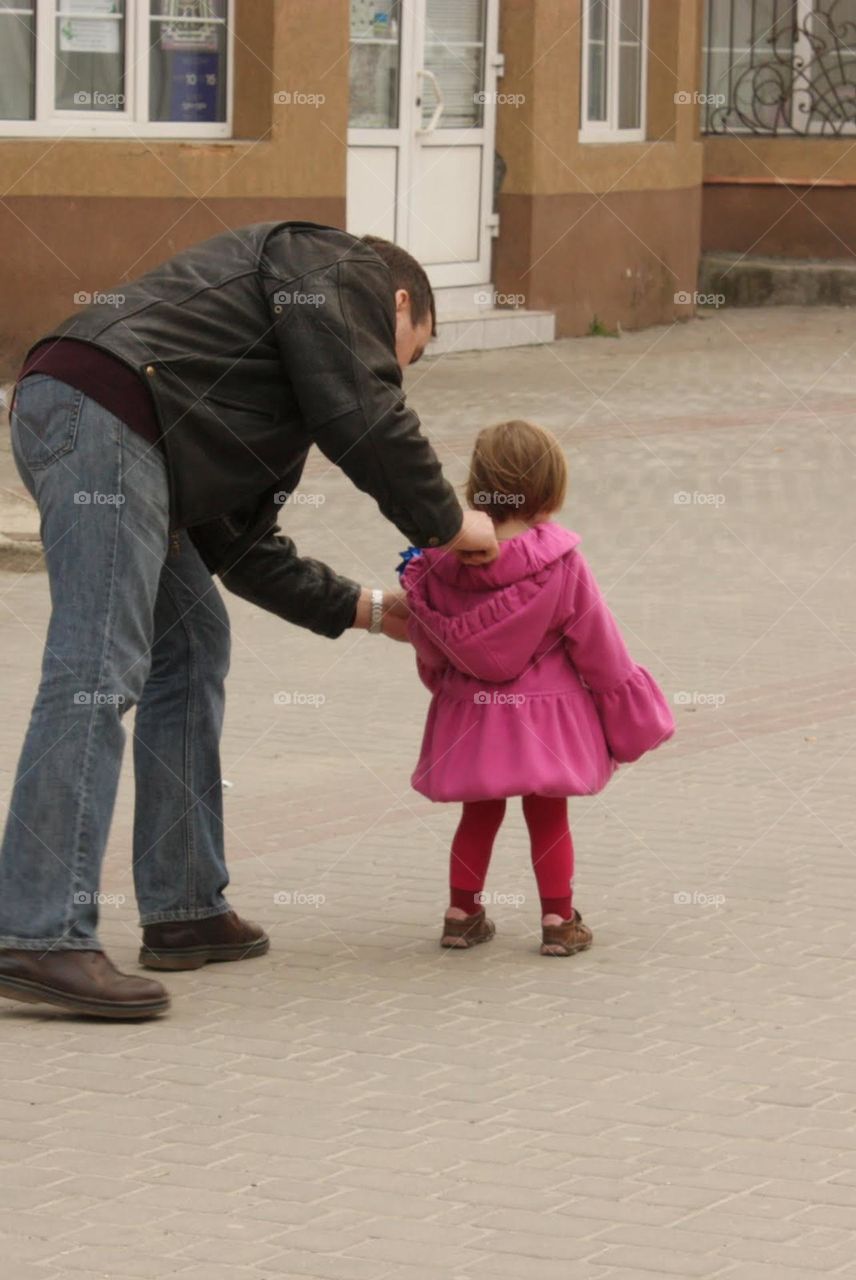 Father taking care of his daughter