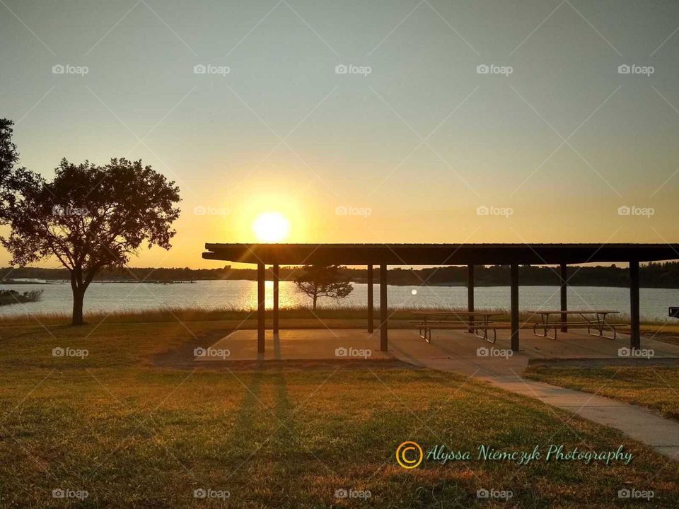 Stunning sunset at picnic shelter by the lake "Sit With Me Awhile". Beautiful fall colors are popping!