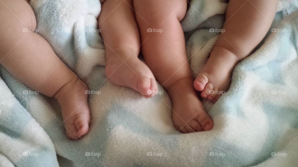 Twins. These are my baby twins' little chubby legs. Its just so cute.