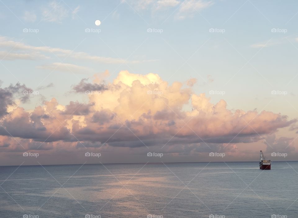 The moon above the ocean