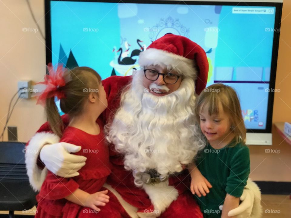 Biological sisters with Down syndrome see Santa