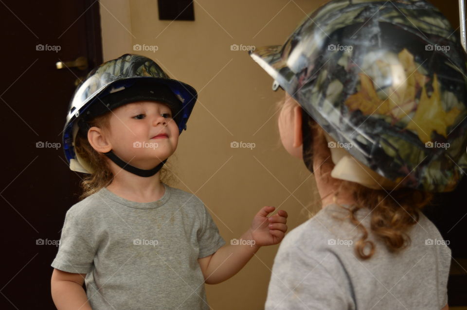 Child in unique helmet
