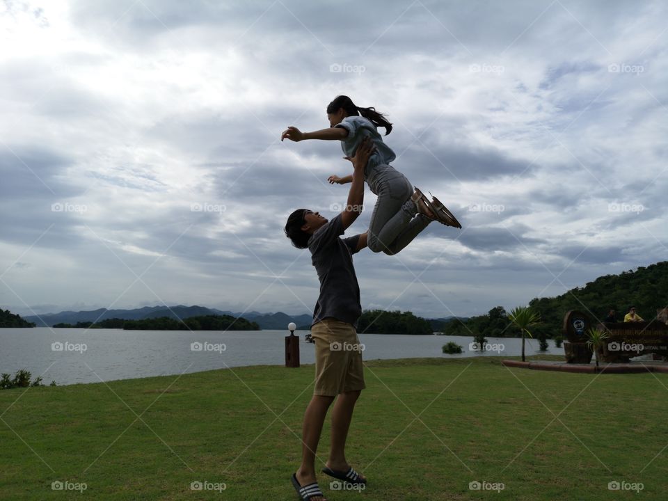Sweet moment of couple near lake side.