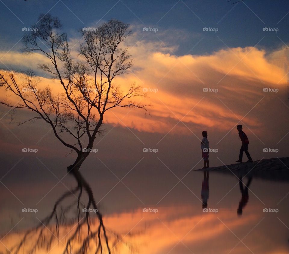 boy and girl at sunset 