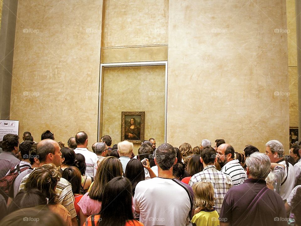 Mona Lisa before the smart phone era, inside the Louvre museum in Paris
