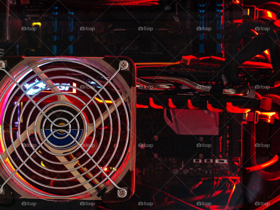 Inside view of a personal computer, some parts are lightened with red light