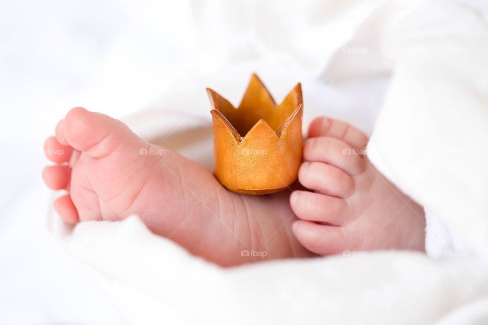Baby feet with crown