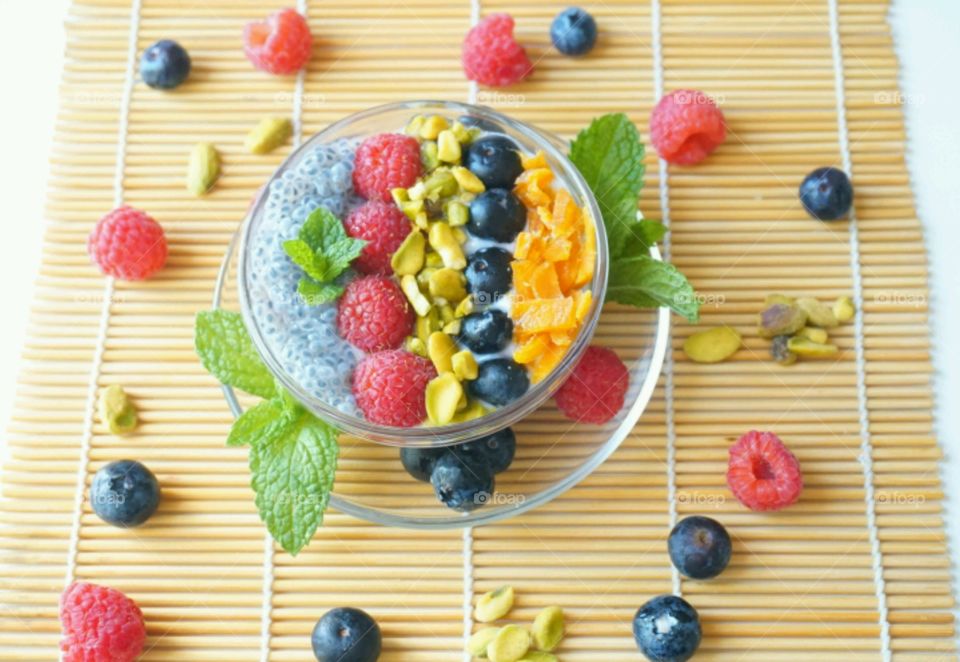 Smoothie Fresh Fruits Bowl - raspberry, blueberry,  mango, nuts and basil seeds
