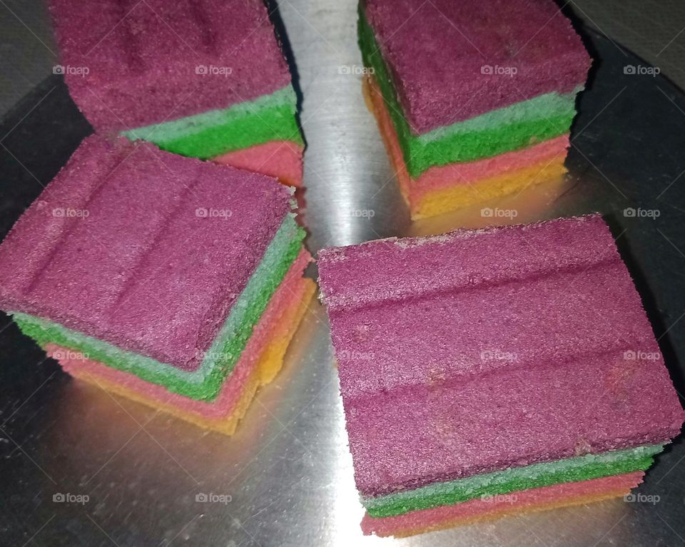 Delicious rainbow cake on pan