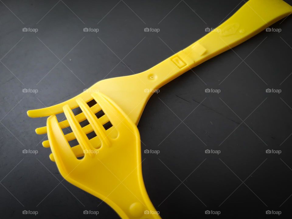 Yellow Forks on a black background