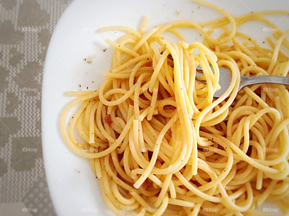 Spaghetti portion on a white plate 
