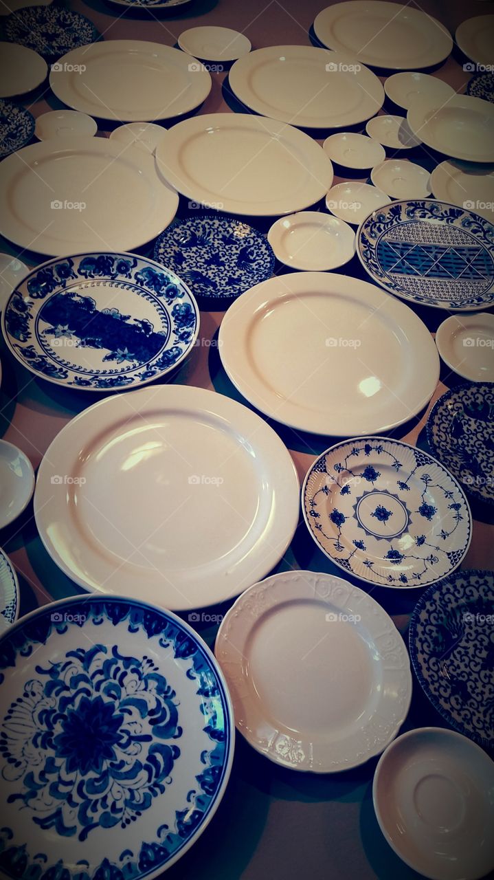 Too many plates. Interior decoration