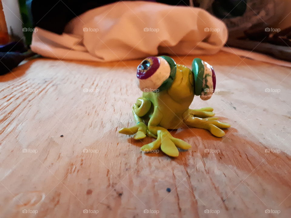 Homemade green clay frog left side shot
