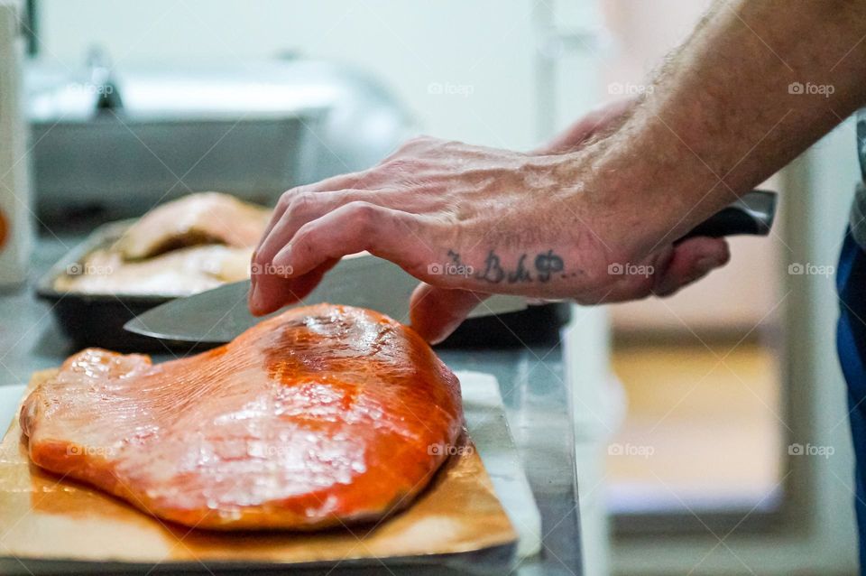 Cook making fish