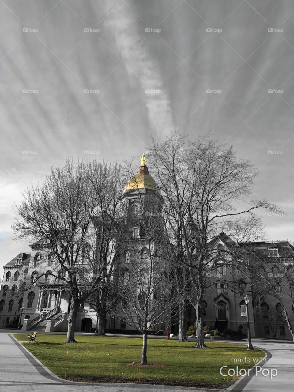 Black and white with color pop of admin building at ND