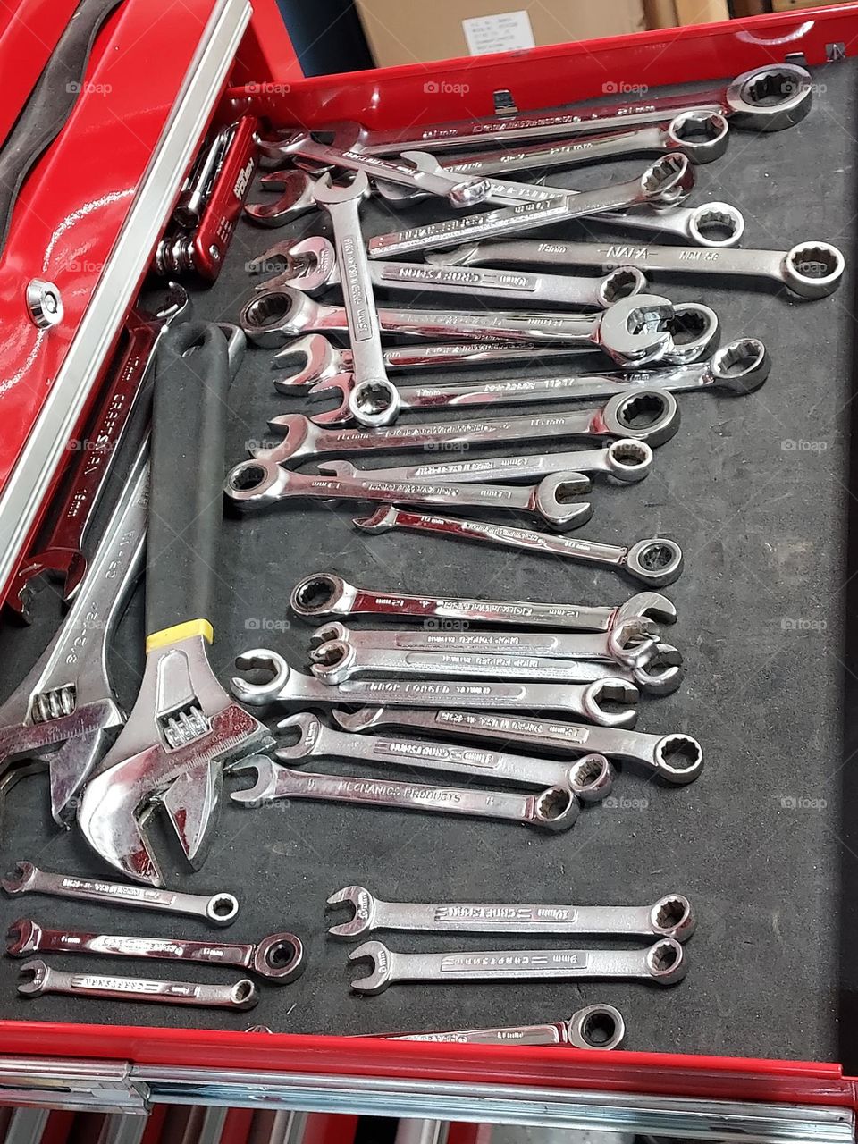 messy drawer full of wrenches
