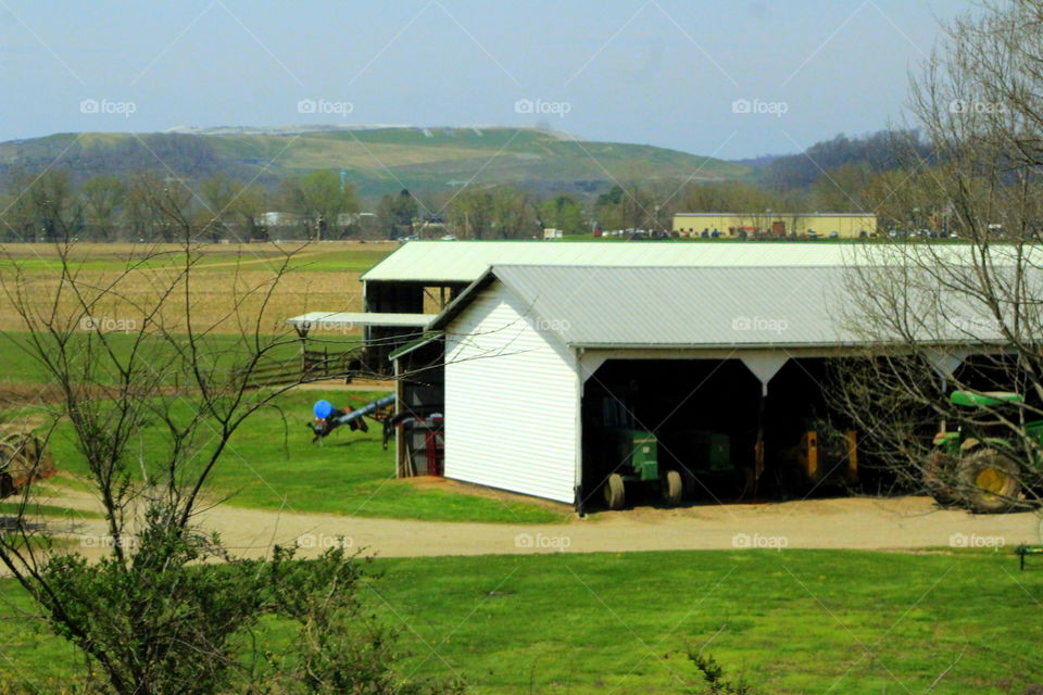 This is a picture of a farm with a barn out in the country of Point Pleasant, West Virginia.
