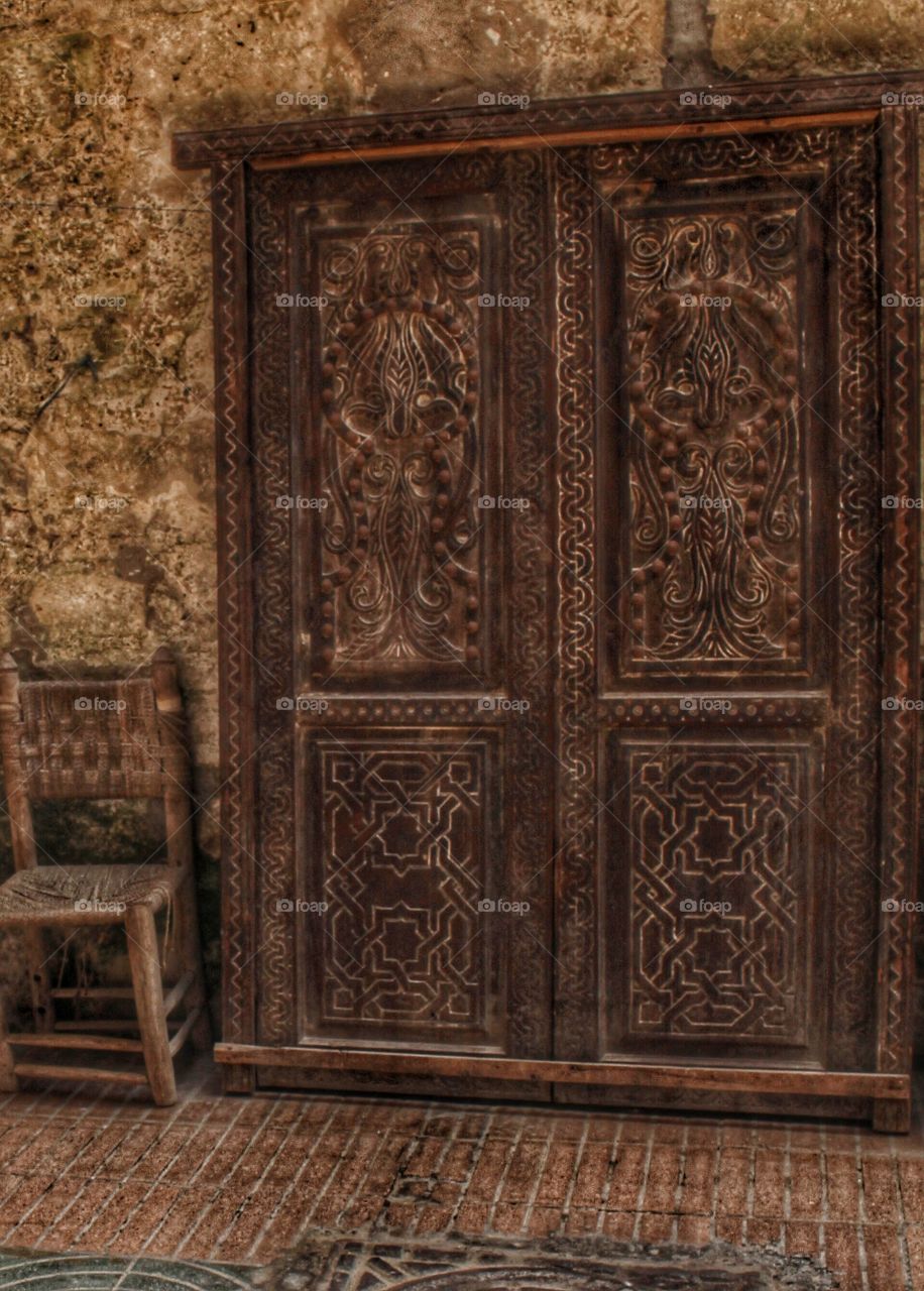 Ornate, carved wooden door