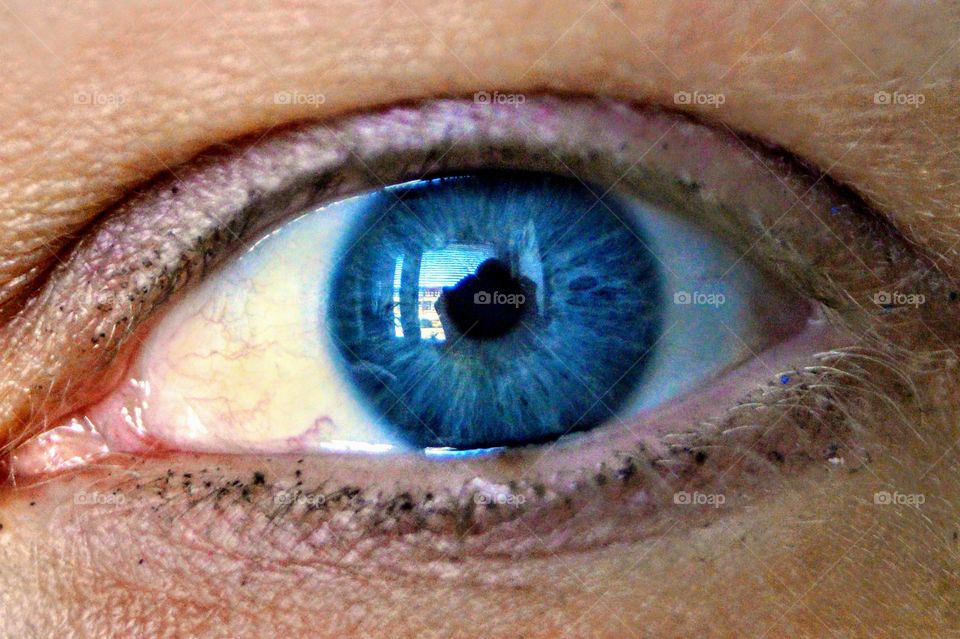 My wife eye and my reflection in eye