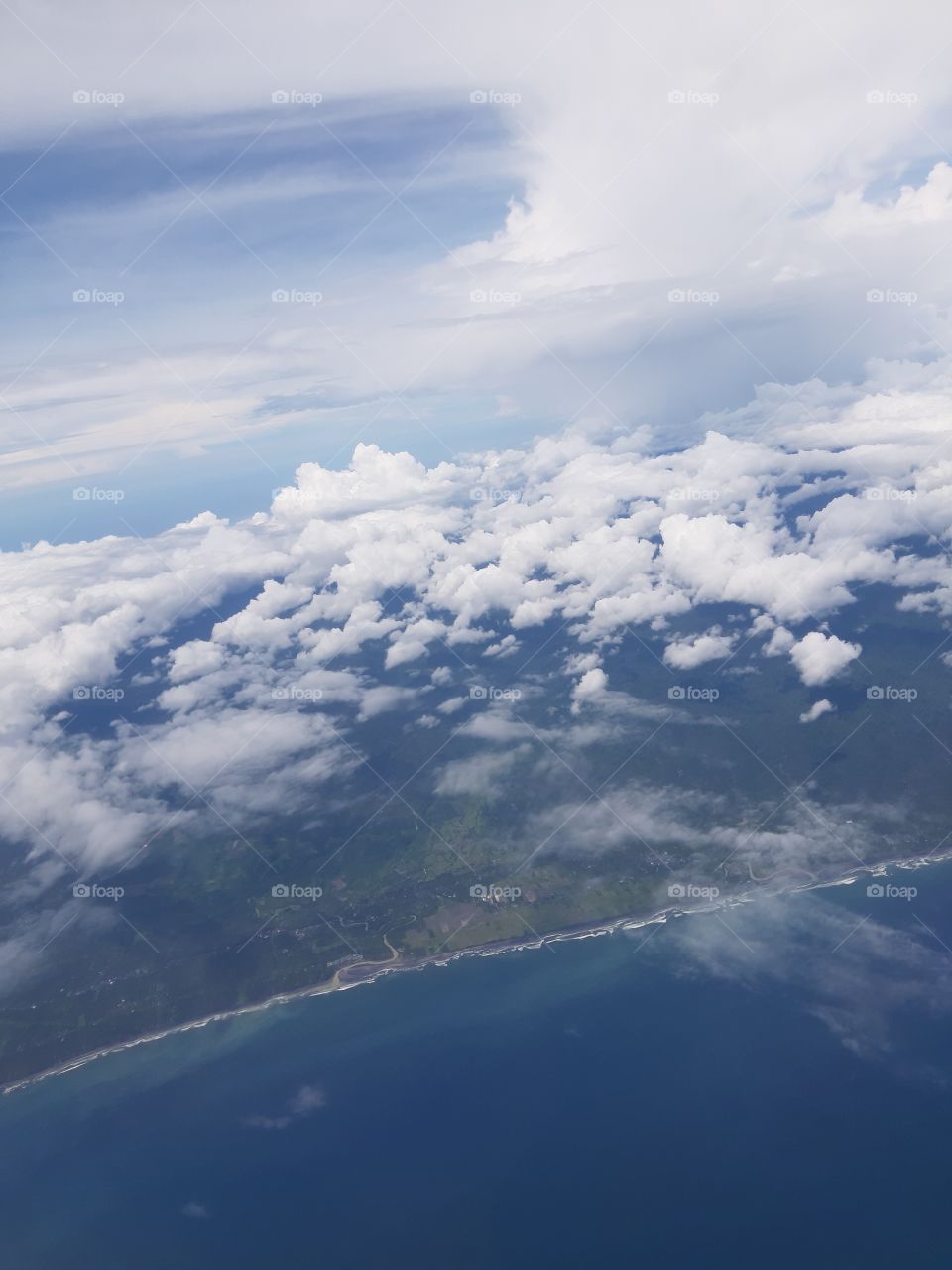 A land and ocean view seen from the sky