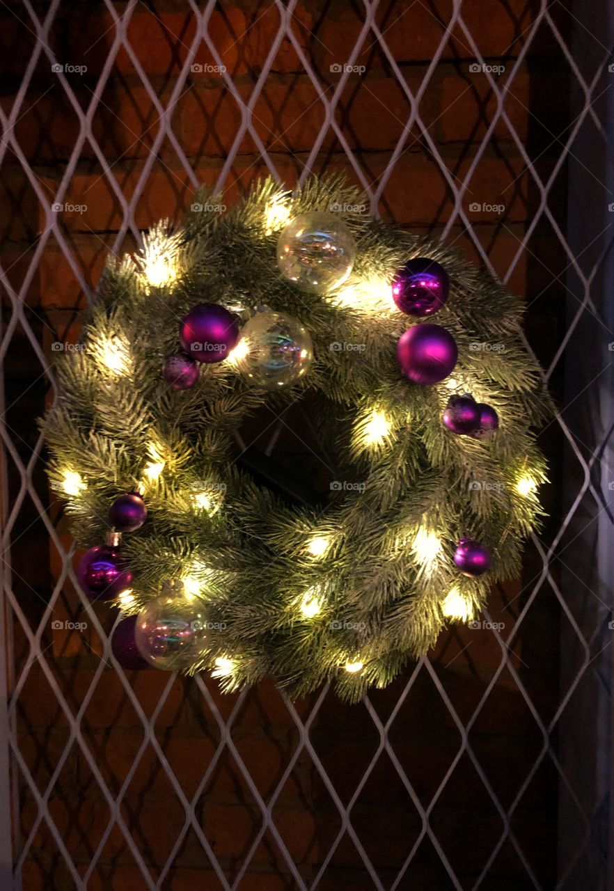 Christmas decorations with balls, lights and green tree