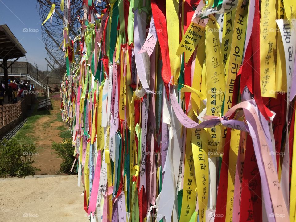 Hope for Unification-
Ribbons tied on a fence between North and South Korea