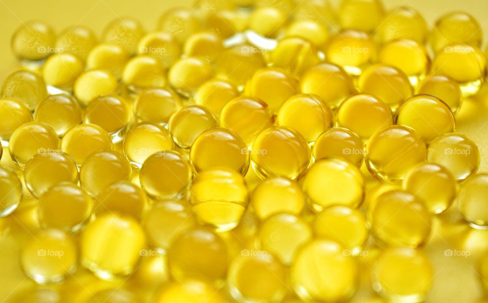 vitamin capsules oils close up round beautiful texture background