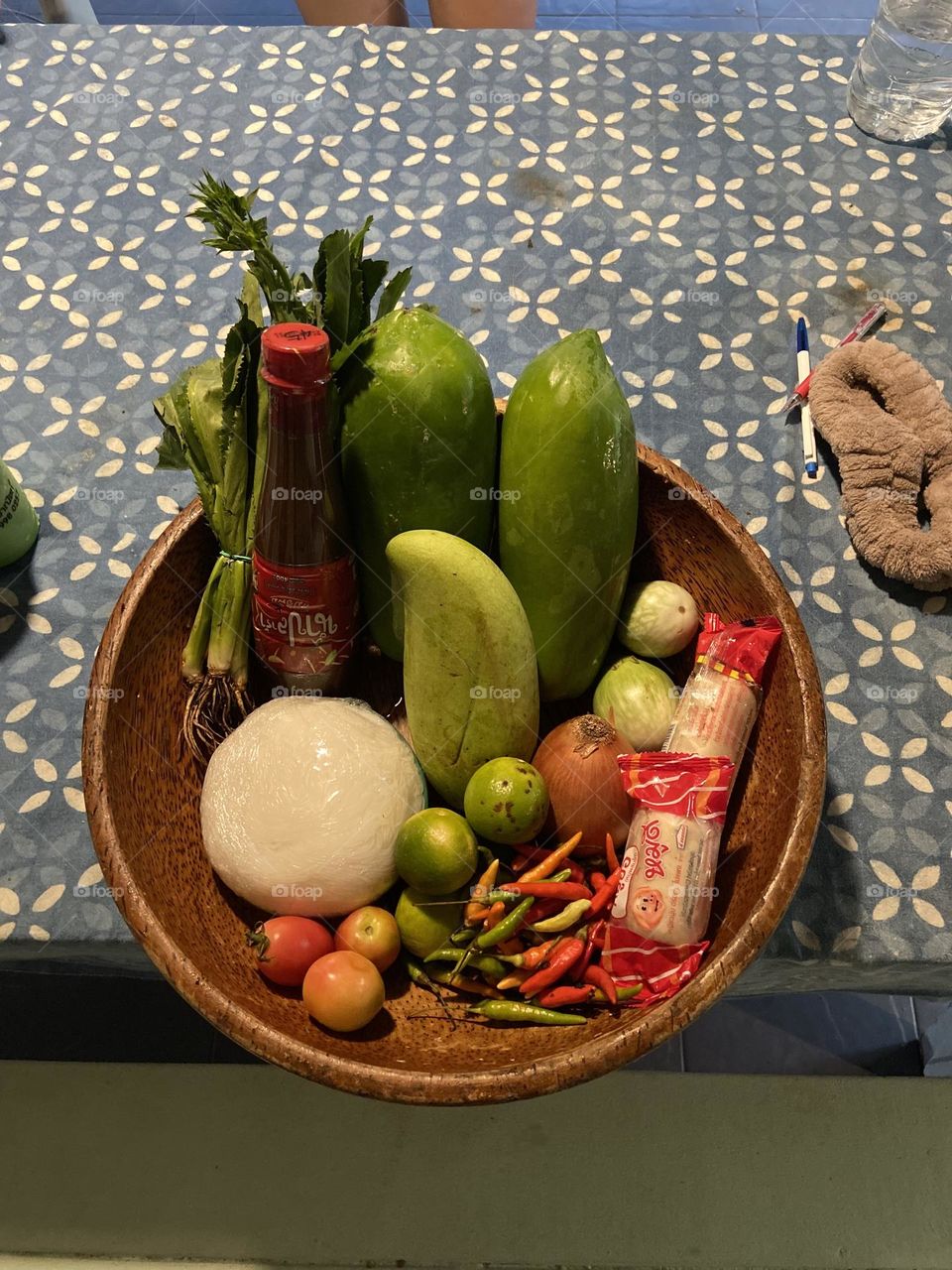Vibrant colours in bowl of Thai ingredients for som tam 