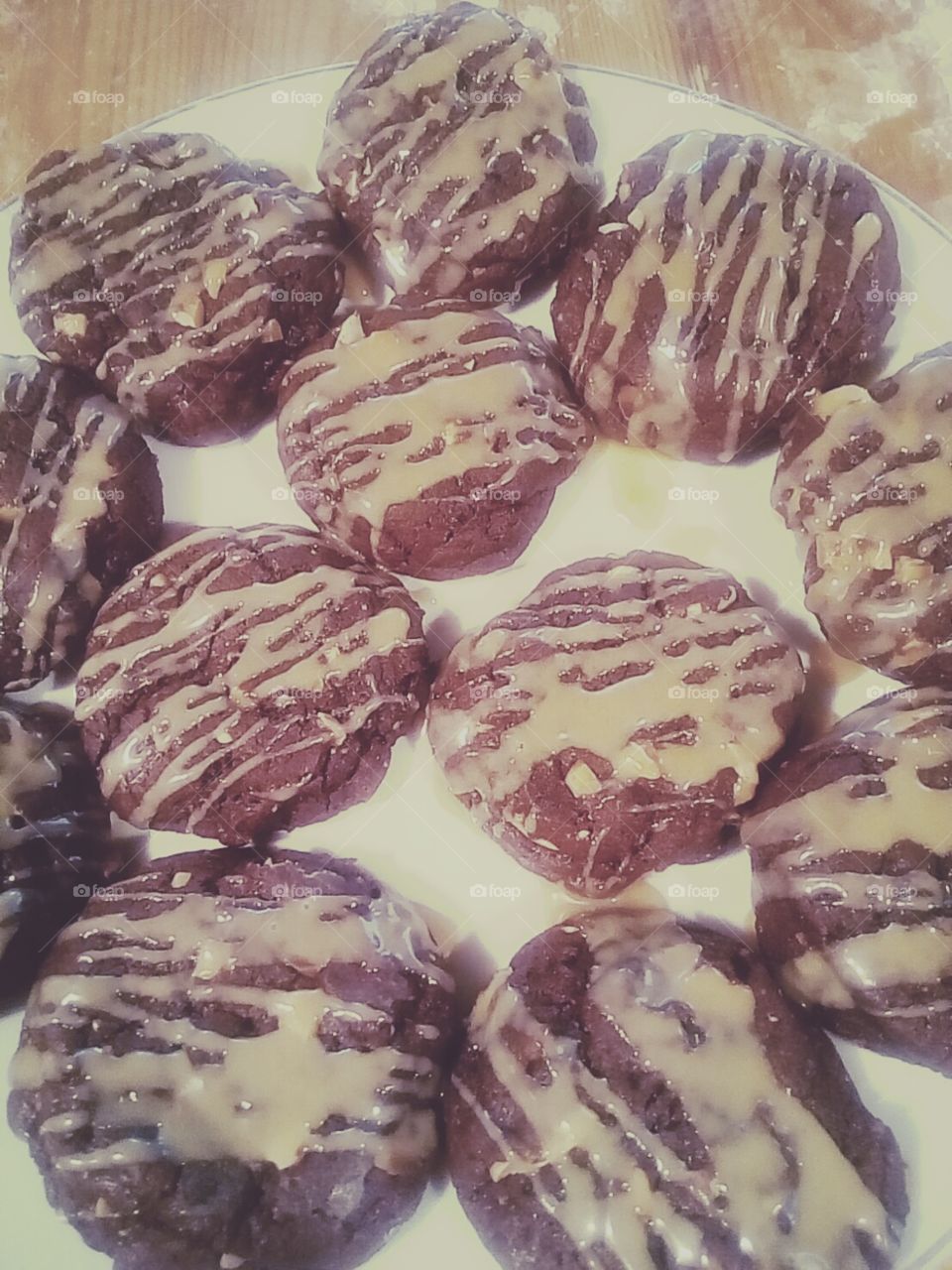 Freshly Baked Chocolate Almond Cookies, lightly drizzled with some Peanut Butter Glaze.