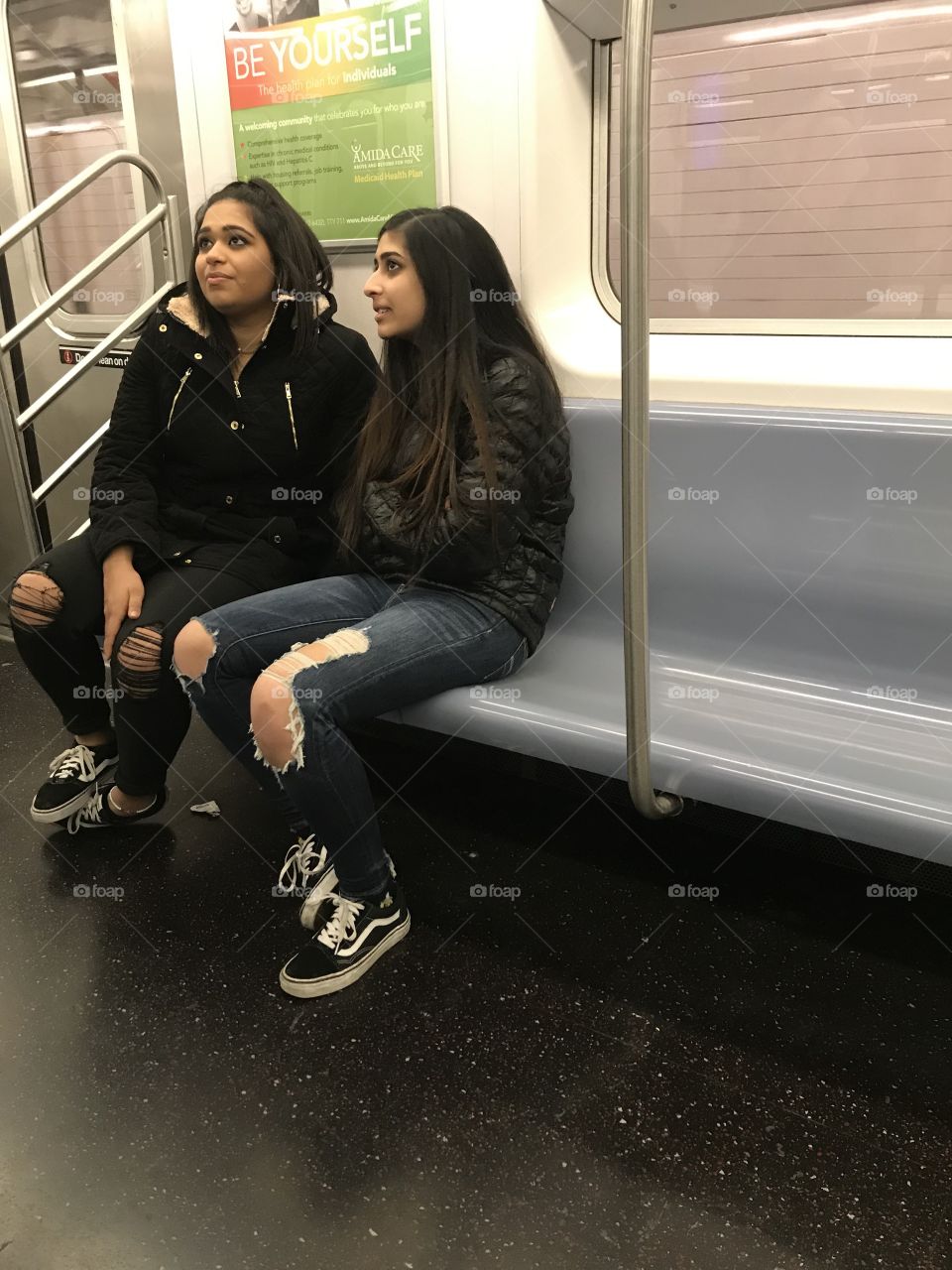 Two young women attempt to be kind to a homeless fellow on the downtown No. 2 local train near 23rd street, about 2:42 AM.