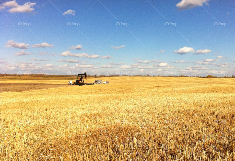 field pumpjack farm oil well by redrock