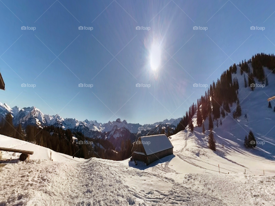 The sun on the mountain top in Switzerland