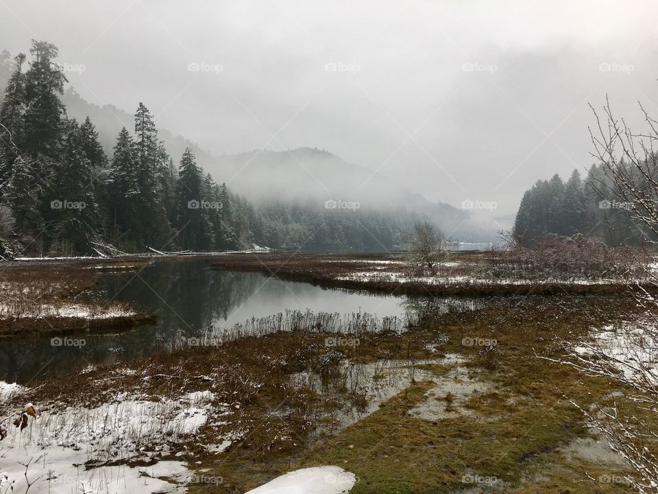 High angle view of foggy mountains