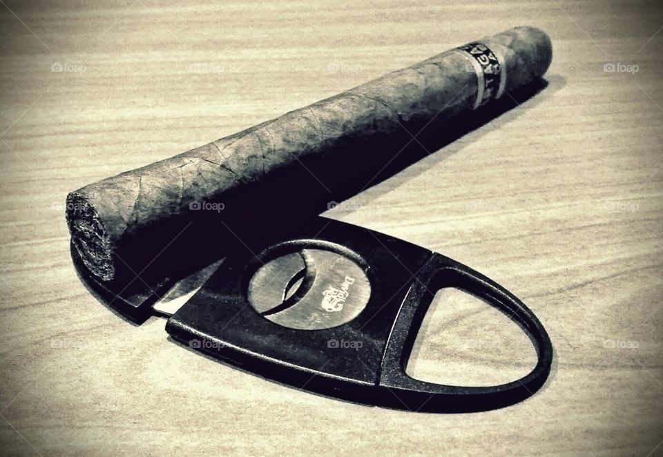 Cigar and cutter. A partagas cuban cigar and a cutter