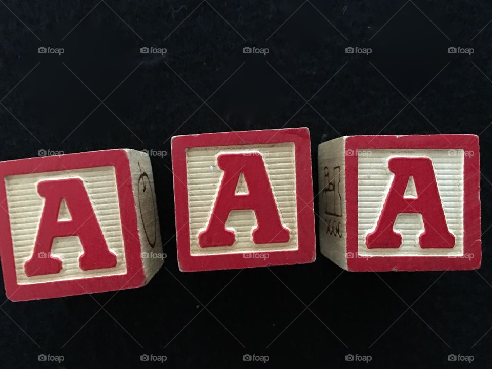 AAA letter blocks in red