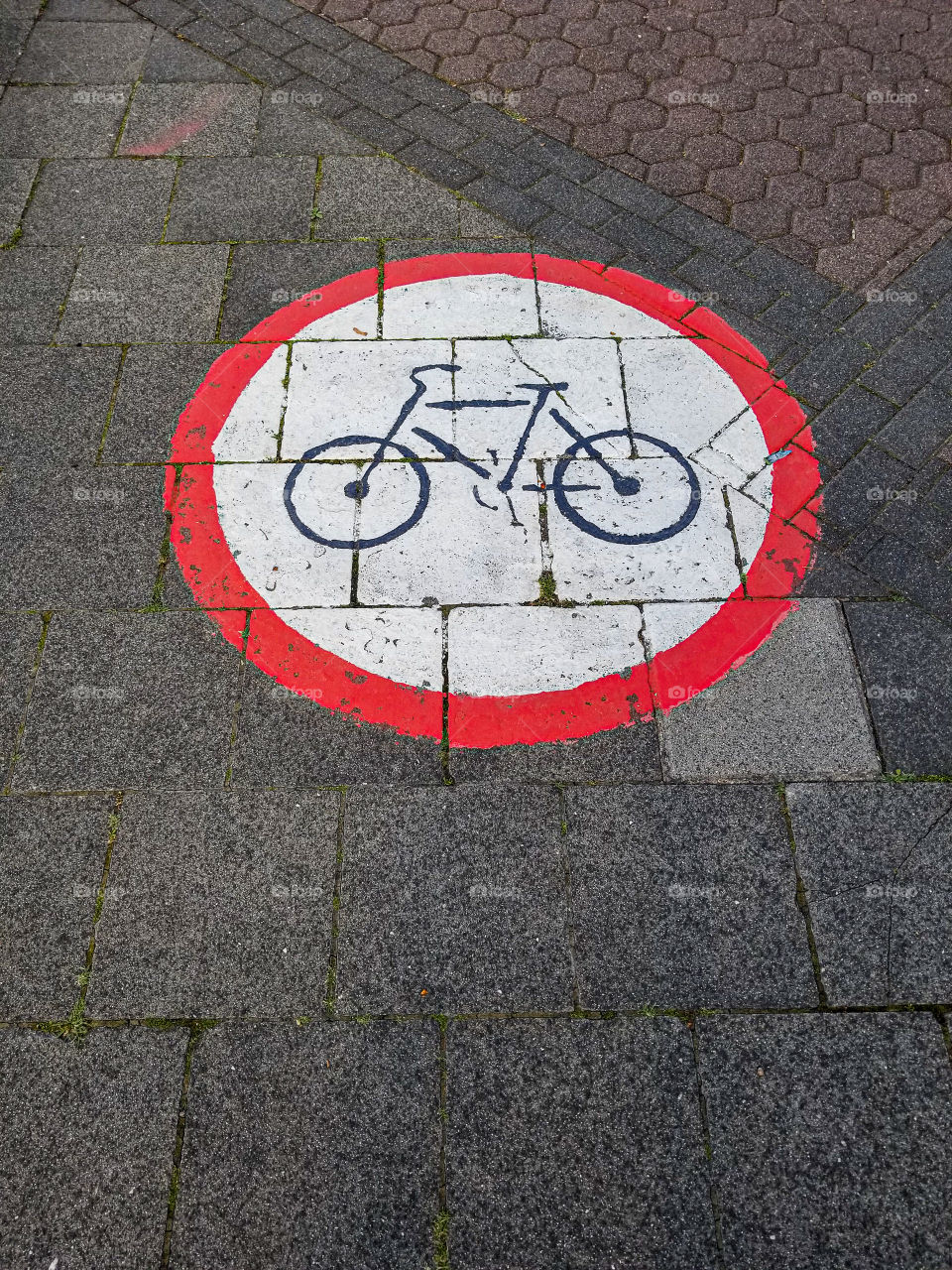 Bike symbol on sidewalk