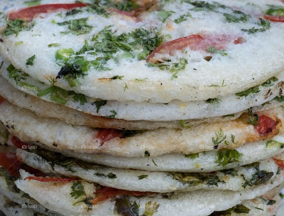 Delicious Myanmar’s street food , coriander and Tomato pizza .. health food