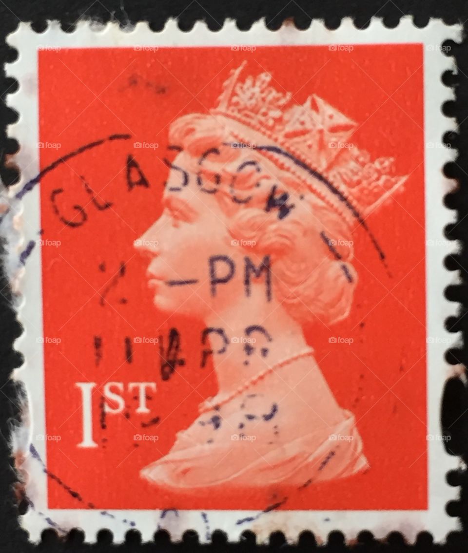 British first class stamp with queen portrait and Glasgow rubber stamp