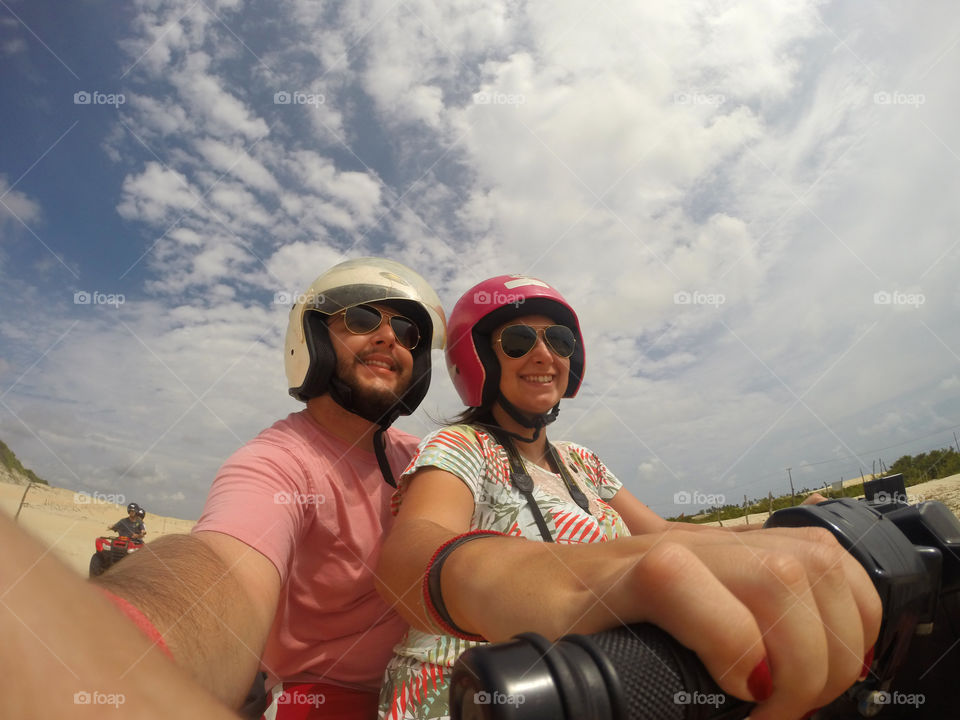 Couple driving a quadricycle