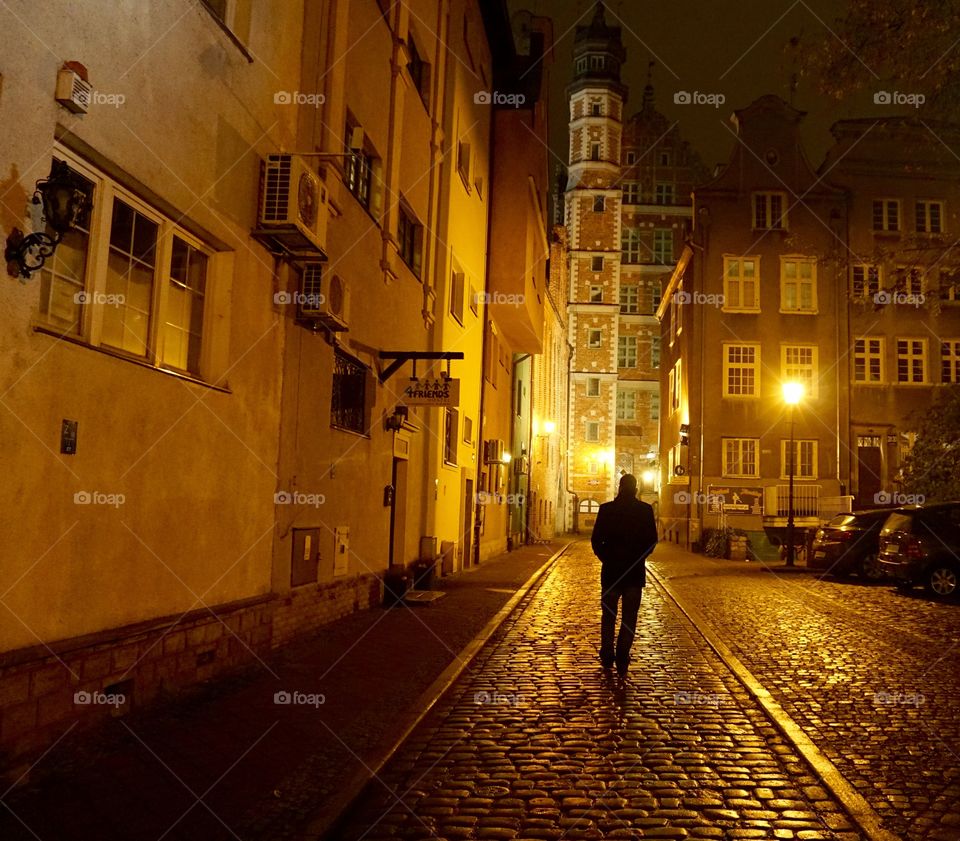 Yellow hues at night in Gdansk bouncing everywhere off the old tall buildings and cobblestones ...