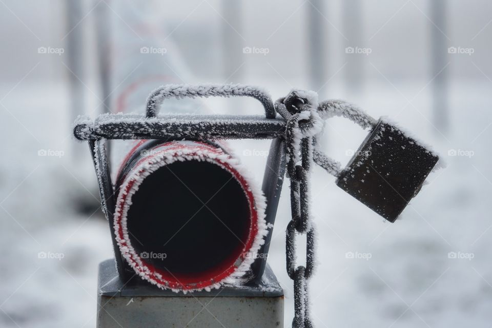 Padlock with icy crystals