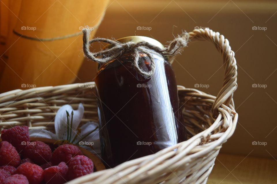 Raspberry jam in basket