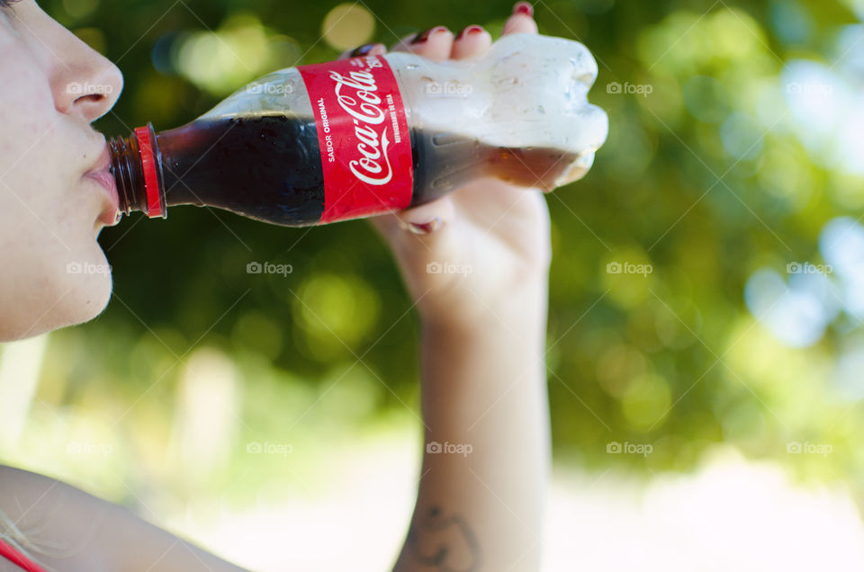 Woman drinking Coke