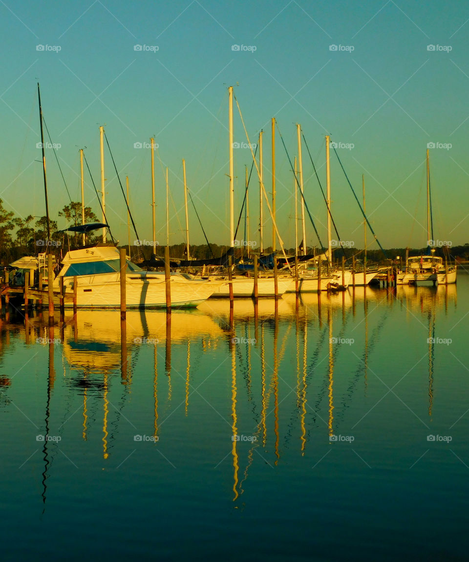 Boats reflecting in sea