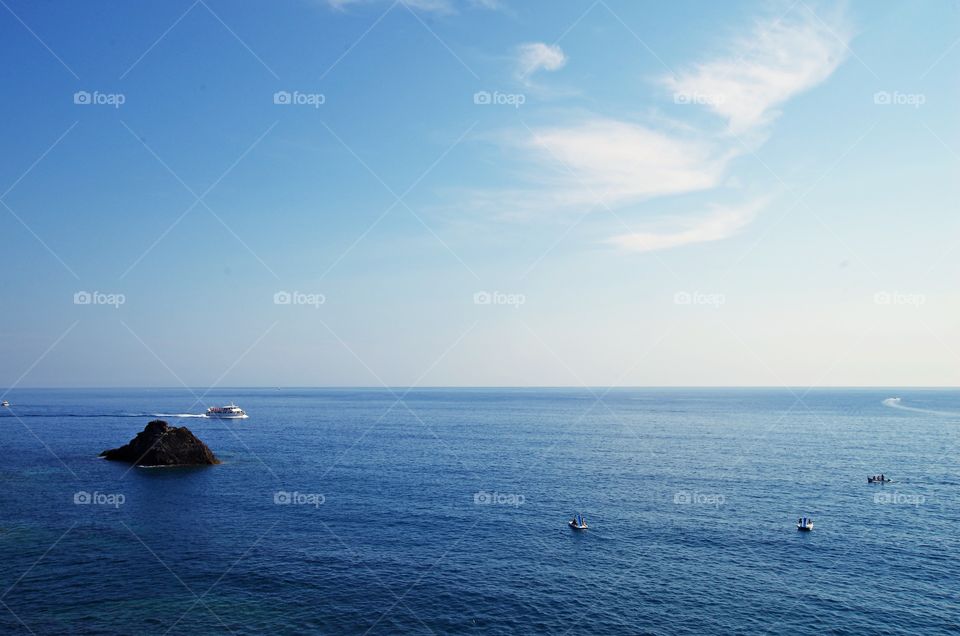 Beautiful ocean view with ship and blue sky in cinque terre Italy