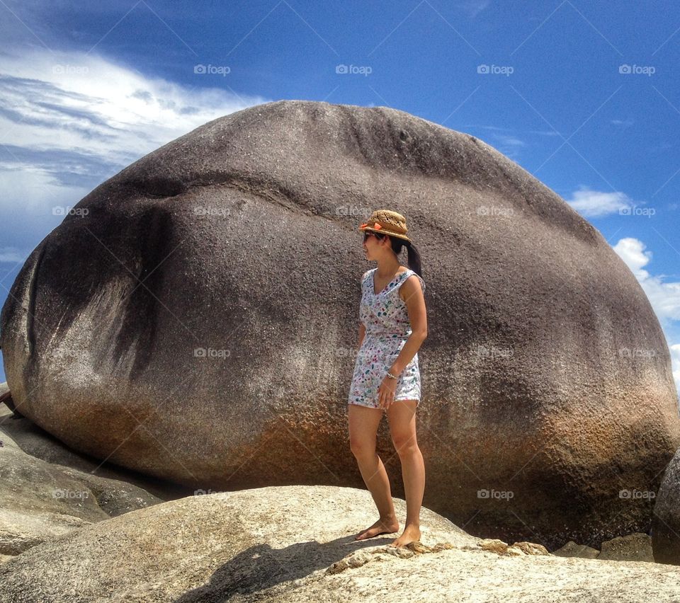 Girl and a big rock